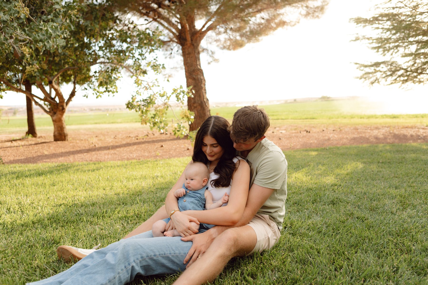 Family portrait session at golden hour in a field